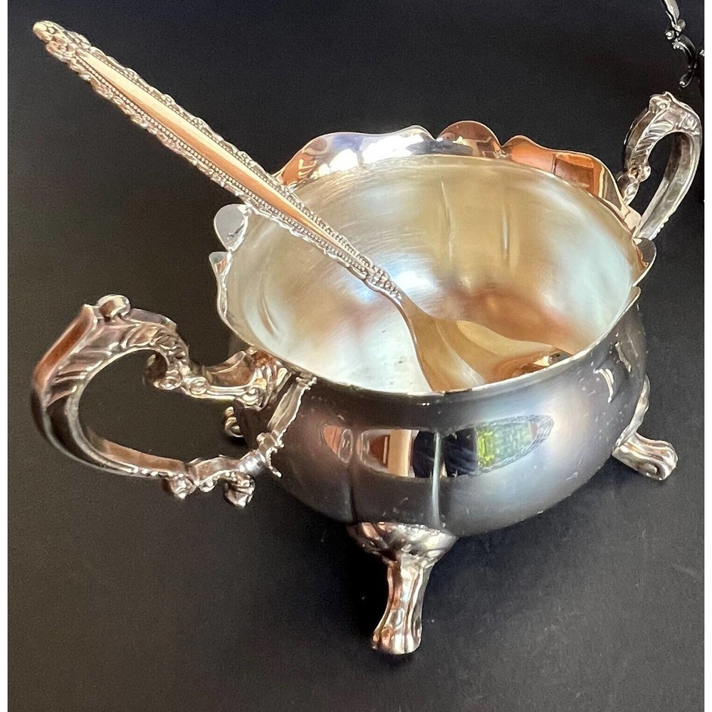 Silver condiment bowl and spoon set by Leonard silverplate